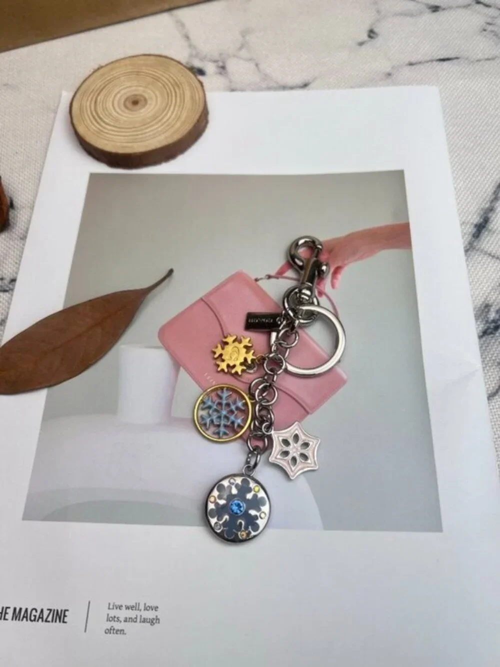 Coach Silver-Tone & Light Blue Snowflake Charm Keychain with Gold Accent